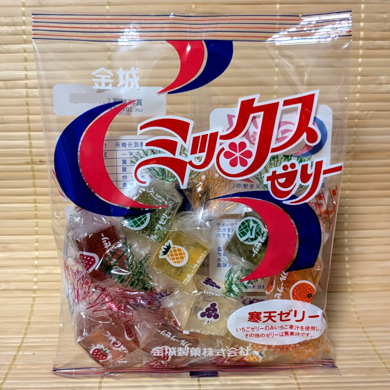 A pack of Kinjo Seika Jelly Candy comprised of colorful mixed fruit varieties. Displayed on a tatami background.