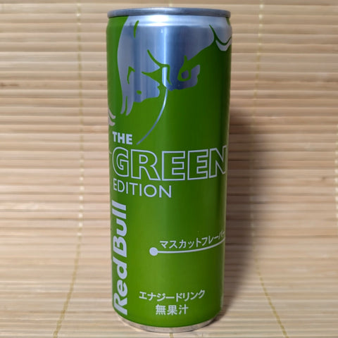 Green can of Muscat Grape Japanese Red Bull Green Edition on a tatami mat.