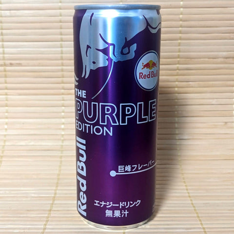 A can of Kyoho Grape Red Bull Energy Soda with 'THE PURPLE EDITION' text placed on a bamboo mat.