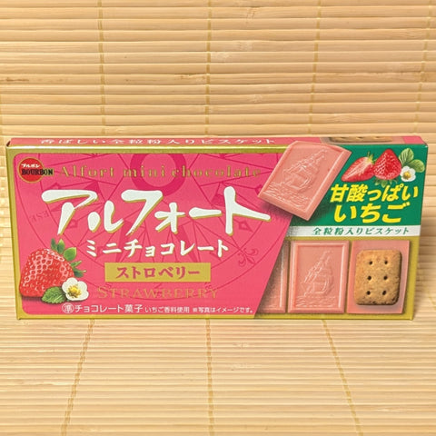 Box of strawberry-flavored Alfort chocolate cookies with Japanese text on a bamboo mat background