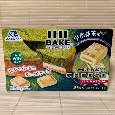 A green and black box of Morinaga BAKE featuring 10 pieces of Uji Matcha cheesecake-flavored baked chocolate treats.