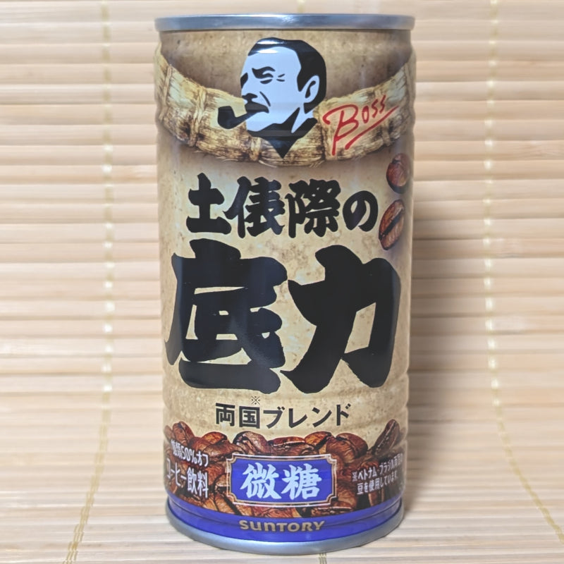 Gold and black can of Suntory BOSS Coffee featuring a sumo wrestler illustration.