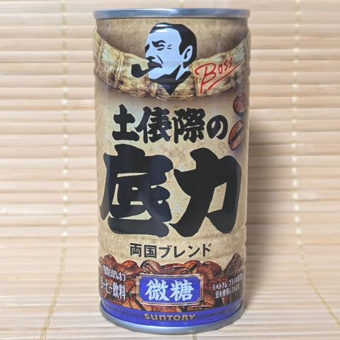 Gold and black can of Suntory BOSS Coffee featuring a sumo wrestler illustration.