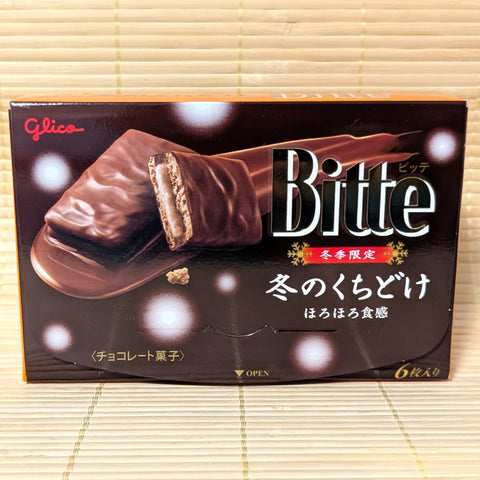 A box of Glico Bitte winter Kuchidoke chocolate displayed on a tatami surface