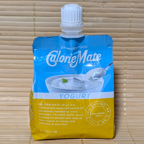 A blue and yellow squeezable pouch of Calorie Mate Jelly featuring an illustration of a bowl of creamy yogurt with a mint leaf.