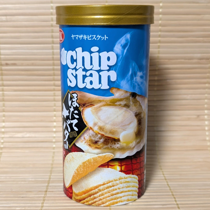 Can of Chip Star potato chips that carry a rich buttery scallop flavor. Blue and gold can on a tatami background.