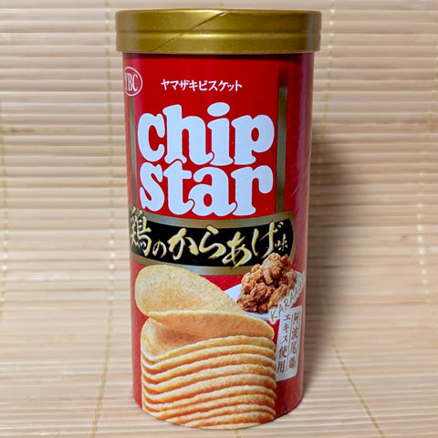 A red and gold tube of YBC Chip Star Karaage Fried Chicken flavor is displayed on a tatami background.