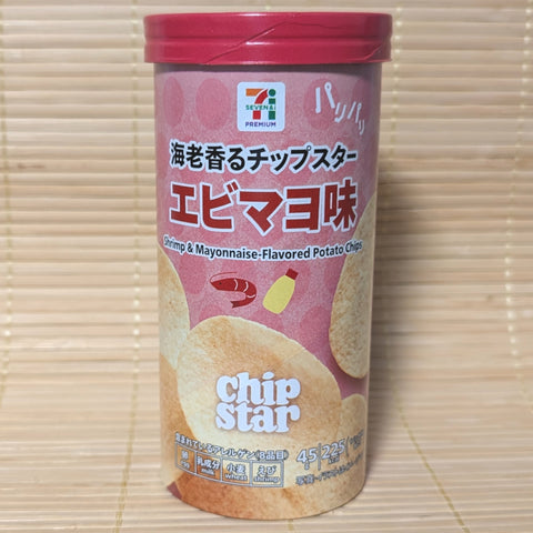 A pastel pink cardboard tube of Seven Eleven exclusive Chip Star Ebi Mayo potato chips on a tatami background.
