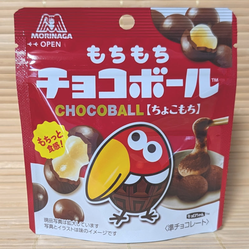 A deep red 39g pouch of Choco Ball Chocolate Mochi displaying Kyoro-chan mascot on a bamboo mat background.
