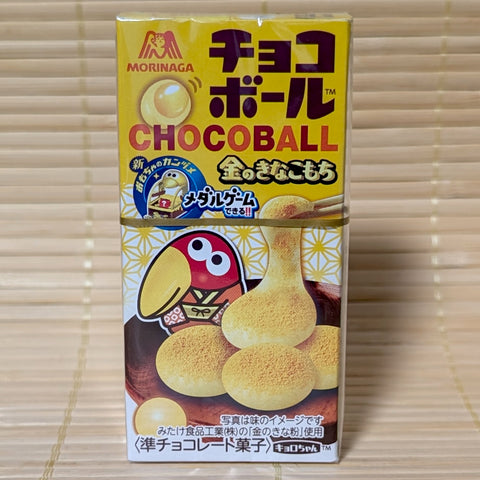 A yellow box of Morinaga Chocoball Golden Kinako Mochi featuring a bird character in a kimono. The item is displayed on a tatami background.
