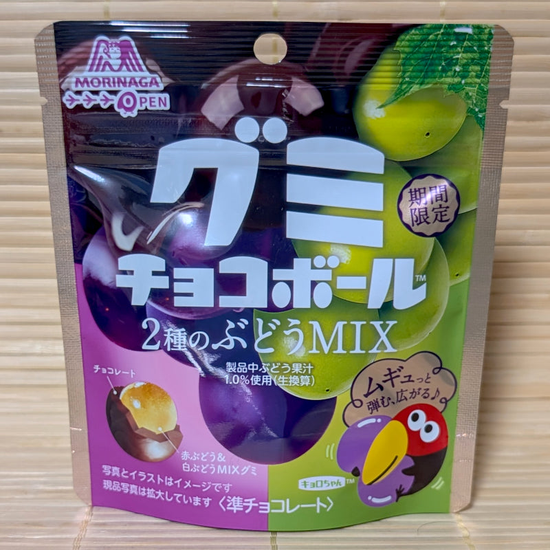 A purple and green pouch of Morinaga Choco Ball Gummy Grape Mix is displayed on a tatami background.