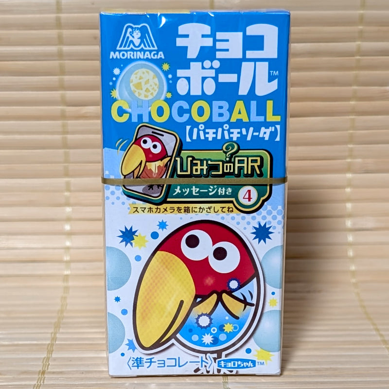 A blue and white 25g box of Morinaga Chocoball Pachi Pachi Soda flavor showing the Kyoro-chan bird mascot holding a smartphone on a tatami background.
