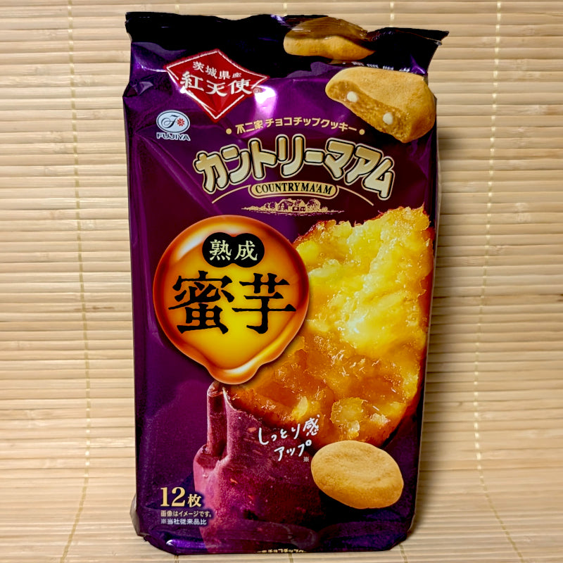 A deep purple 120g bag of Fujiya Country Ma'am Aged Honey Sweet Potato cookies showing roasted Benitenshi sweet potato artwork and soft cookies on a bamboo mat background.