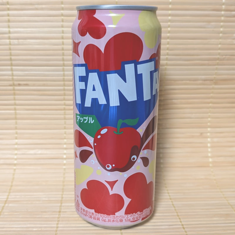 A tall can of Fanta Soda with a red apple theme, featuring a large apple graphic and hearts in the background.