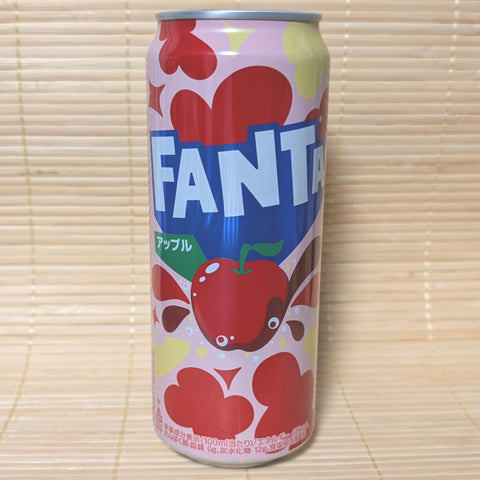 A tall can of Fanta Soda with a red apple theme, featuring a large apple graphic and hearts in the background.