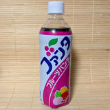A 490ml PET bottle of Japanese Fanta Fruit Punch showing retro Japanese Katakana font and fruit illustrations on a bamboo mat background.