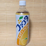 A limited edition Fanta Golden Apple bottle with retro label in Japanese, against a tatami mat background