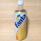 A limited edition Fanta Golden Apple bottle with retro label, against a tatami mat background