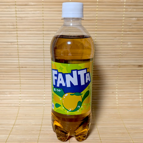 Fanta Ume Golden Plum bottle on a woven mat background
