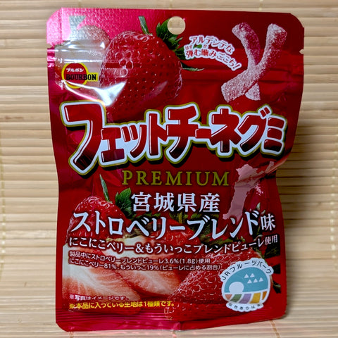 Red pouch of Bourbon Premium Fettuccine gummies featuring large Miyagi strawberries and al dente candy.