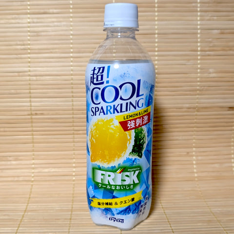 A clear 490ml PET bottle of DyDo Cho Cool Sparkling FRISK-inspired soda showing icy blue graphics, lemons, limes, and a green FRISK logo on a tatami background.