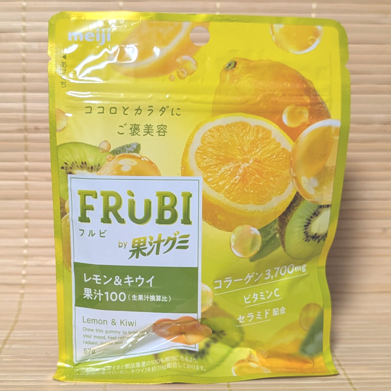 A bright yellow and green resealable pouch of Meiji Frubi Lemon and Kiwi gummies showing fresh cut fruits on a tatami background.