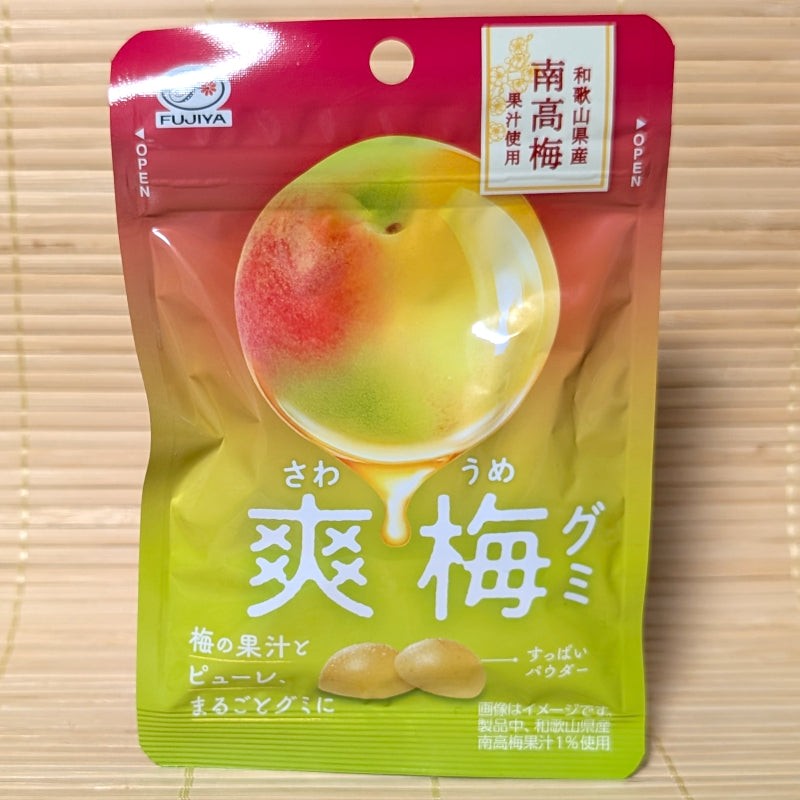 Gold and pink pouch of Fujiya Sawa Ume gummies featuring a large green and pink Nanko plum.