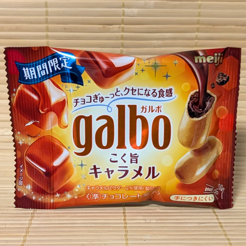A Meiji Galbo caramel candy package on a wooden surface
