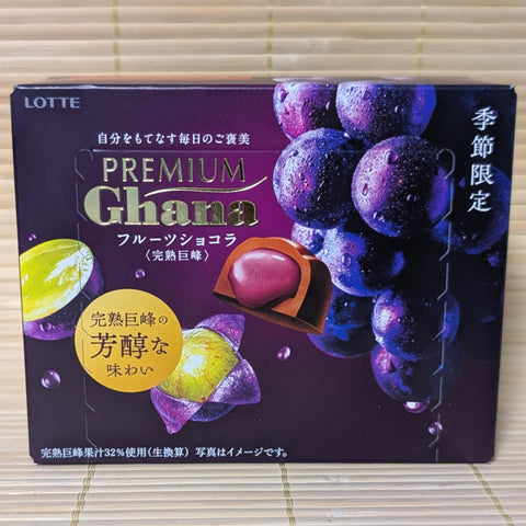 A box of LOTTE Premium Ghana chocolate Kyoho Purple Grape displayed on a tatami surface.
