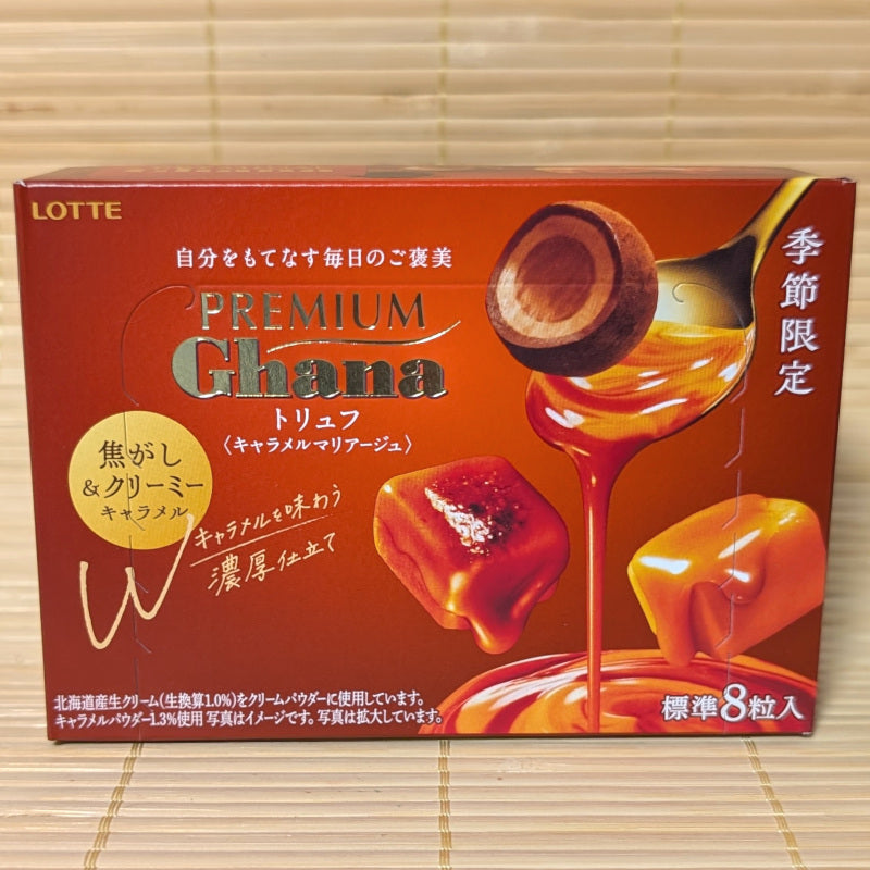 A LOTTE Premium Ghana Caramel Truffle chocolate box on a tatami surface