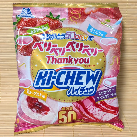 A HUGE bag of 50 Morinaga Hi-Chew strawberry flavors, 4 varieties in all. The  package is displayed on a wooden surface.