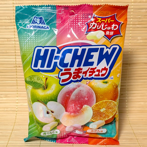 A 68g bag of Morinaga Umaichew 3-Flavor Fruit Mix featuring Green Apple, White Peach, and Mikan Orange, resting on a bamboo mat.
