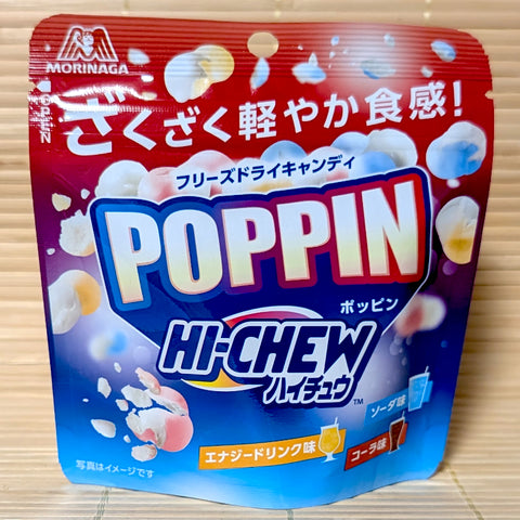 A vibrant red and blue 18g pouch of Morinaga Poppin Hi-Chew showing freeze-dried crunchy candy balls on a bamboo mat background.