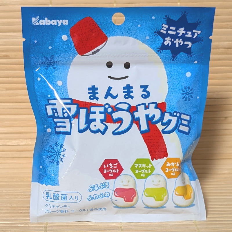 A bright blue winter pouch of Kabaya Manmaru Yukibouya Snowman Gummies featuring cute snowman graphics on a bamboo background.