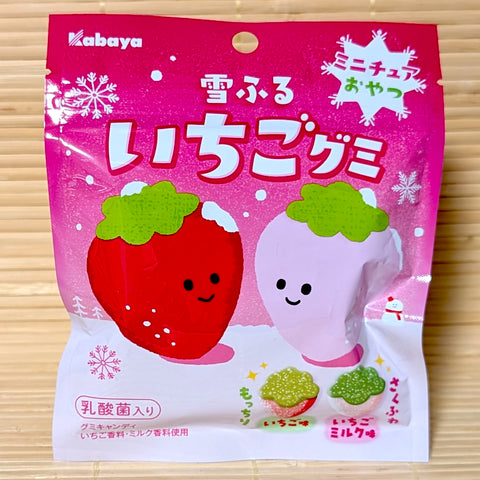 A bright pink winter pouch of Kabaya Yuki Furu Strawberry Gummies featuring cute snow-capped strawberry graphics on a bamboo background.