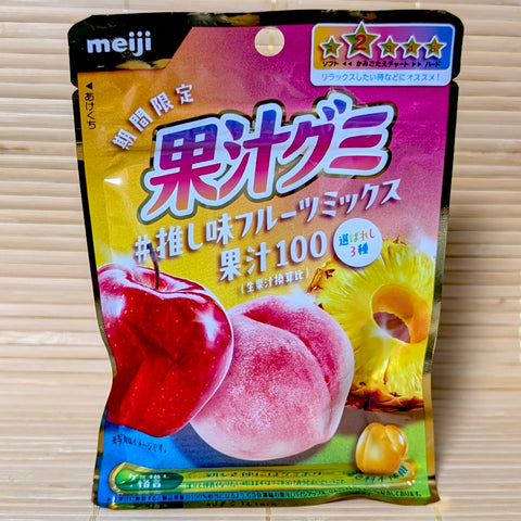 A white and fruit-patterned pouch of Meiji Kaju Gummy 3-Fruit Luxury Blend featuring 2600mg of collagen.