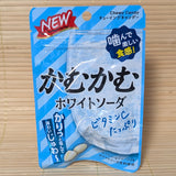 A light blue 30g pouch of Kamu Kamu White Soda Chewy Candy with new packaging layout featuring an icy glass of white soda on a bamboo mat.
