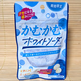 A light blue 30g pouch of Kamu Kamu White Soda Chewy Candy with new packaging layout featuring an icy glass of white soda on a bamboo mat.