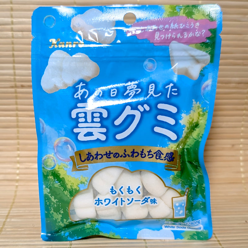 A bright blue sky themed pouch of Kanro Cloud Gummy candy showing fluffy white cloud graphics and a clear window on a tatami background.