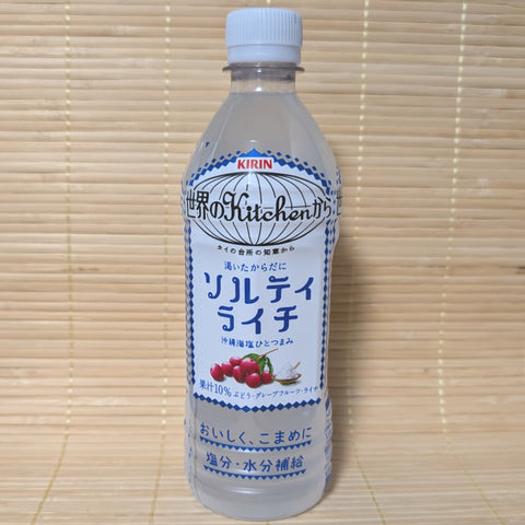 A 500ml PET bottle of Kirin Salty Lychee drink with blue and white diamond patterns and a graphic of fresh lychees and salt.