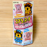Front and back views of a pink 46g hexagonal box of Koala's March Cutie Street Strawberry Biscuits showing anime koala idol characters on a bamboo background.