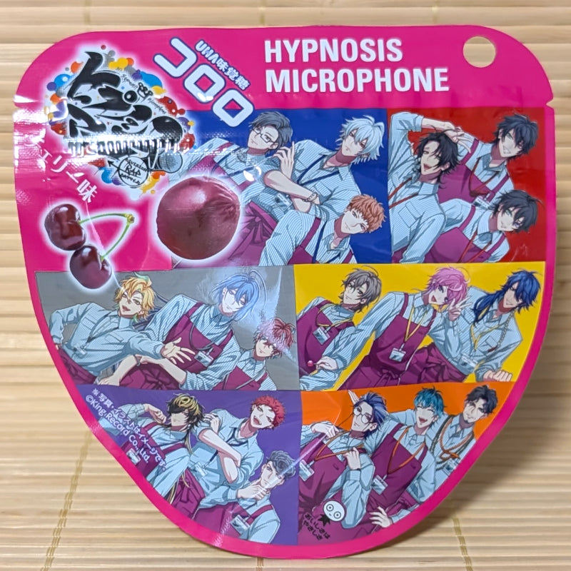A bright pink 40g pouch of Kororo Cherry gummies featuring Hypnosis Microphone anime characters on a bamboo mat background.