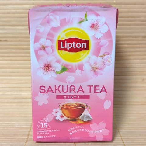 Pink Lipton Sakura Tea packaging on a tatami surface.