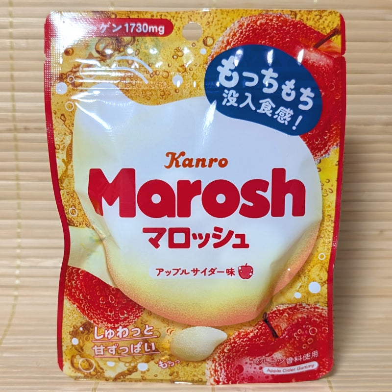 A Kanro Apple Cider flavored Marosh candy package on a wooden surface