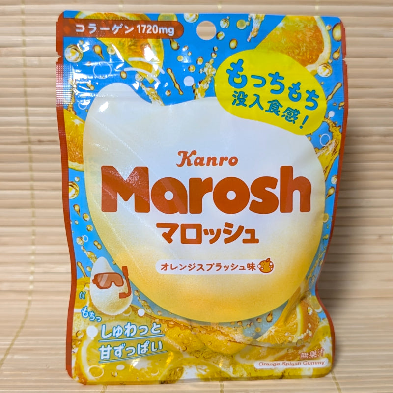 A blue and orange resealable pouch of Kanro Marosh Orange Splash gummy on a tatami background featuring a marshmallow-gummy hybrid character.