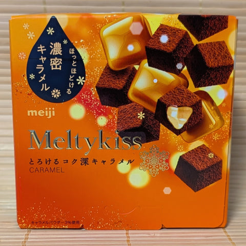 Meiji Meltykiss caramel chocolate packaging on a wooden surface