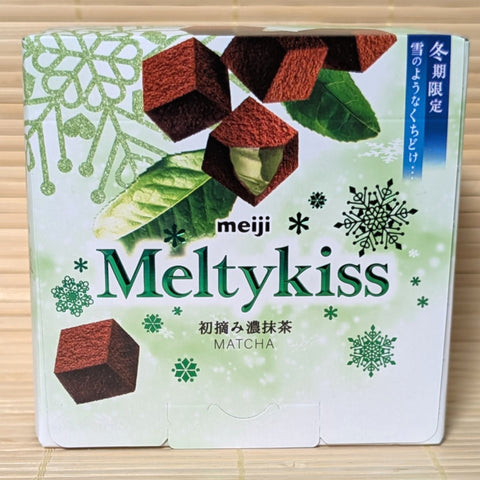 Meiji Meltykiss Matcha chocolate packaging on a wooden surface