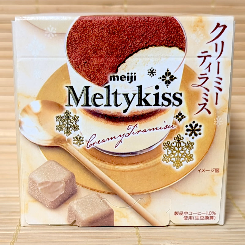 Small elegant box of Meiji Meltykiss Creamy Tiramisu chocolates featuring an image of the dessert and cocoa-dusted cubes.