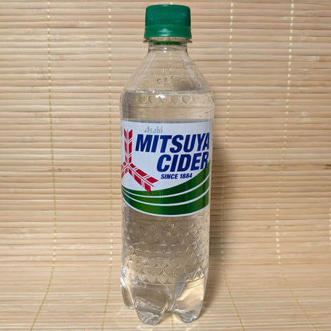 A clear 500ml plastic PET bottle of Asahi Mitsuya Cider with its signature green and white label, set against a traditional Japanese tatami background.