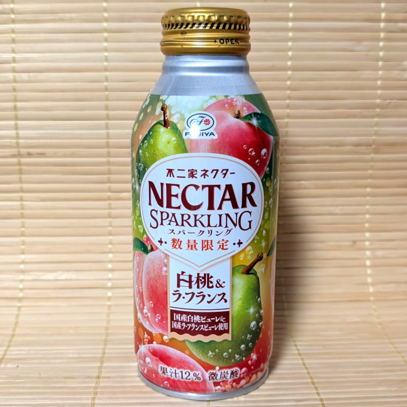 Bottle of NECTAR Peach and La France Pear SPARKLING juice. Displayed on a tatami surface.